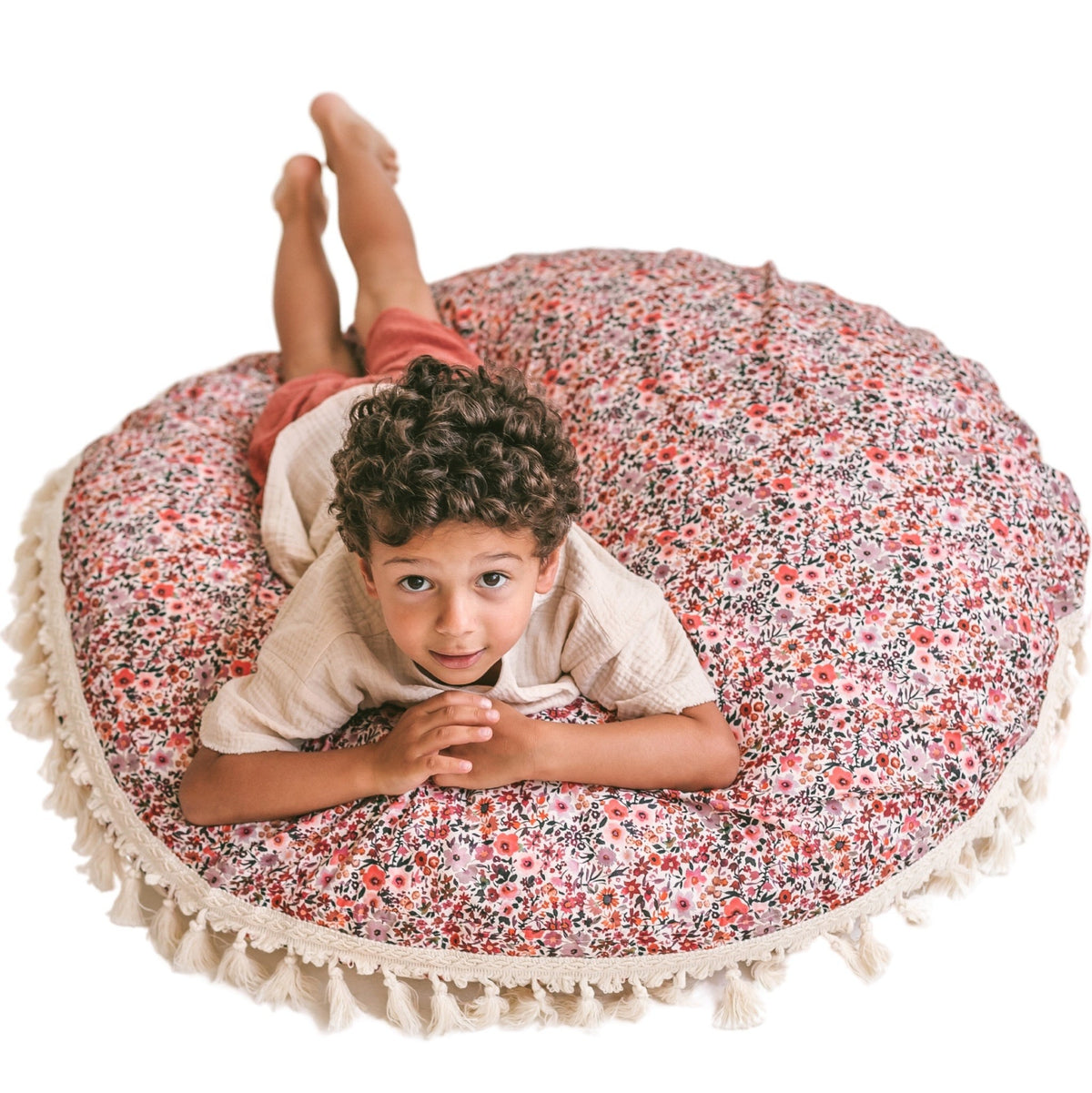 Coussin de sol à glands rose fleuri Minicamp